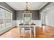 Cozy dining area with hardwood floors, wainscoting and a large window for natural light at 3207 Oak Ridge Cir, Lincolnton, NC 28092