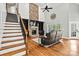 Spacious living room with a stone fireplace, built-in shelving, a soaring ceiling, and large windows at 3207 Oak Ridge Cir, Lincolnton, NC 28092
