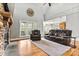 Inviting living room with a stone fireplace, large windows, and comfortable seating at 3207 Oak Ridge Cir, Lincolnton, NC 28092