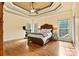 Spacious main bedroom with trey ceilings, large windows, and hardwood floors at 3207 Oak Ridge Cir, Lincolnton, NC 28092