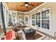 Cozy screened-in porch featuring a wood ceiling, comfortable seating, and scenic views at 3207 Oak Ridge Cir, Lincolnton, NC 28092
