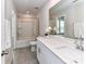 Clean bathroom featuring tub/shower combo, a white vanity with white counter and mirror at 3524 Auburn Curb Rd, Charlotte, NC 28217