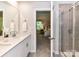Bathroom with double sinks, view to shower and bedroom at 3524 Auburn Curb Rd, Charlotte, NC 28217