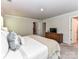 Bright bedroom with plush carpet, closet, and ensuite bath at 3524 Auburn Curb Rd, Charlotte, NC 28217