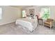 Relaxing bedroom with a queen bed, side tables, lamps, and natural light from two windows at 3524 Auburn Curb Rd, Charlotte, NC 28217