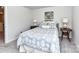 Bright bedroom with large window, area rug, side tables and comfortable bed at 3524 Auburn Curb Rd, Charlotte, NC 28217
