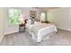 Cozy bedroom featuring large windows, a comfortable bed, and soft carpeting at 3524 Auburn Curb Rd, Charlotte, NC 28217