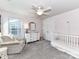 Light pink Bedroom with white furniture, crib and reading chair at 3524 Auburn Curb Rd, Charlotte, NC 28217