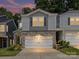 Charming townhouse with a two-car garage, stone accents, and manicured landscaping at 3524 Auburn Curb Rd, Charlotte, NC 28217