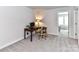 Functional home office setup, featuring desk, chair, lamp, and great natural lighting at 3524 Auburn Curb Rd, Charlotte, NC 28217