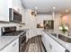 Well-equipped kitchen with granite countertops, stainless steel appliances, and a functional layout at 3524 Auburn Curb Rd, Charlotte, NC 28217