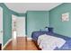 Bedroom with bed, wall decor and an open door with view of a hallway at 365 Kinder Rd, Harmony, NC 28634