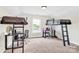 Bedroom with carpet, bunk beds, ladders, study tables and a window at 365 Kinder Rd, Harmony, NC 28634
