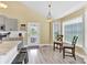 Cozy breakfast nook area with sunny windows and seamless access to the kitchen and backyard at 365 Kinder Rd, Harmony, NC 28634