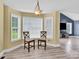 Cozy breakfast nook area with bright windows and seamless access to the living area at 365 Kinder Rd, Harmony, NC 28634
