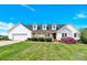 Charming two-story home with a well-manicured lawn, inviting front porch, and attached two-car garage at 365 Kinder Rd, Harmony, NC 28634