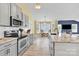 Well-equipped kitchen featuring stainless steel appliances, stylish gray cabinets, and granite countertops at 365 Kinder Rd, Harmony, NC 28634