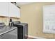 Laundry room featuring new appliances including a front load washer and dryer at 365 Kinder Rd, Harmony, NC 28634