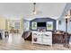 Open-concept living room features large windows, a cozy seating area, and access to the dining area at 365 Kinder Rd, Harmony, NC 28634