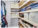 A well-organized walk-in closet with custom shelves and multiple storage bins at 365 Kinder Rd, Harmony, NC 28634