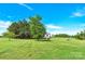 A charming elevated treehouse sits in the yard of this home on a sunny day at 365 Kinder Rd, Harmony, NC 28634