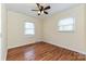 Bright bedroom with hardwood flooring, crown molding and natural light from two windows at 3701 Slagle Dr, Charlotte, NC 28215