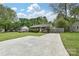 Charming brick home with a lush green lawn and a driveway leading up to the house at 3701 Slagle Dr, Charlotte, NC 28215