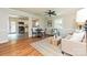 Cozy living room with hardwood floors, an eating space and an open view to the kitchen with modern appliances at 3701 Slagle Dr, Charlotte, NC 28215