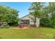 Large backyard with a screened-in porch and comfortable seating at 3790 Lynnview Ct, Maiden, NC 28650