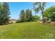 Expansive backyard with lush green lawn, mature trees, and room for outdoor activities at 3790 Lynnview Ct, Maiden, NC 28650