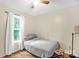 Comfortable bedroom with light yellow walls, wood laminate floors, and a ceiling fan at 3790 Lynnview Ct, Maiden, NC 28650