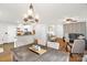 Open floor plan featuring dining area with modern chandelier and view of kitchen and living area at 3790 Lynnview Ct, Maiden, NC 28650