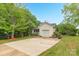 Traditional home with a cozy front porch, attached garage, driveway, mature landscaping and trees at 3790 Lynnview Ct, Maiden, NC 28650