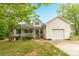 Charming home featuring a welcoming front porch, one car garage, and a well-maintained lawn with mature landscaping at 3790 Lynnview Ct, Maiden, NC 28650