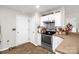 Well-lit kitchen with stainless steel appliances, white cabinets, and tile backsplash at 3790 Lynnview Ct, Maiden, NC 28650