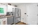 Kitchen featuring stainless steel refrigerator, white cabinets, and neutral countertops at 3790 Lynnview Ct, Maiden, NC 28650
