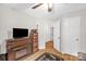 Cozy living room features a wooden TV stand, fireplace, and an open doorway at 3790 Lynnview Ct, Maiden, NC 28650