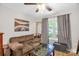 Cozy living room features a ceiling fan, comfortable brown couch, and a unique foosball table at 3790 Lynnview Ct, Maiden, NC 28650