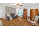 Living room with wood floors, grey sofa, and natural light at 3790 Lynnview Ct, Maiden, NC 28650