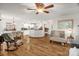Open-concept living space featuring wood floors, dining area, breakfast bar, and ample natural light at 3790 Lynnview Ct, Maiden, NC 28650