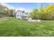 Backyard with above-ground pool, shed, large grassy area, and treed backdrop at 380 Hamrick Rd # 1, Gastonia, NC 28056