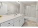 Bathroom with a white sink, white cabinets and a toilet in close proximity to the shower and bath at 380 Hamrick Rd # 1, Gastonia, NC 28056