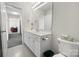 Bathroom with a white sink, white cabinets, toilet, and a view into an adjacent room perfect for getting ready at 380 Hamrick Rd # 1, Gastonia, NC 28056