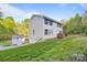 Bright, two-story home with a well-manicured lawn, vinyl siding, and a detached garage at 380 Hamrick Rd # 1, Gastonia, NC 28056