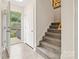 Bright entryway with tile flooring, stairs to the upper level, and access to the porch at 380 Hamrick Rd # 1, Gastonia, NC 28056