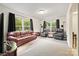 Spacious living room with carpet, two armchairs, and large windows at 380 Hamrick Rd # 1, Gastonia, NC 28056