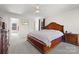 Primary bedroom with neutral colors, a ceiling fan, and an en-suite bathroom at 380 Hamrick Rd # 1, Gastonia, NC 28056