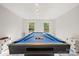Close up of billiards table with vibrant blue felt, ready for a game in this recreation room at 380 Hamrick Rd # 1, Gastonia, NC 28056