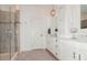 Well-lit bathroom featuring a glass-enclosed shower, vanity with cabinets and modern fixtures at 4024 Whipcord Dr, Waxhaw, NC 28173