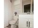 Clean and bright bathroom with a toilet, vanity, and shower with curtain, functional and well-maintained at 4024 Whipcord Dr, Waxhaw, NC 28173